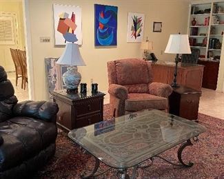 Iron coffee table with glass top ( has a matching sofa table), tapestry upholstered recliner.  Oriental lamp, Original Abstract Art.