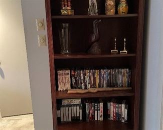 Wood bookcases, VHS tapes, DVDS