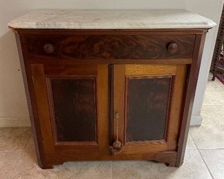Wood cabinet with marble top
