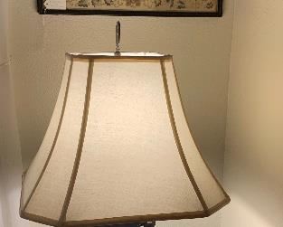 Chinese Table Lamp with Brass Urn Base and silk shade.  Valued at $475. Above the lamp is a Chinese Embroidery on silk. Mid 19th century.  Size is 19 x 19 inch. Valued at $275