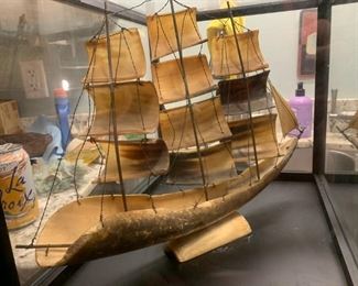 Antique nautical hand carved 3 mast ship with Mirror backed glass display case.     Oops my flavored sparkling water in background. Oh well.  Too late at night
