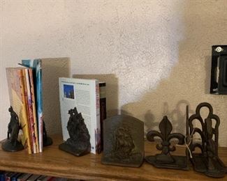 2 pair of Heavy antique bookends, one single bookend (gotta find its mate), and a pair of Fleur dis Lis (Saints) bookends, also heavy