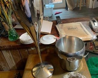 Impress your guests with a unique Champagne bucket - tall and weighted so no tip-over, shaped like a champagne glass. Stainless Steel ice bucket also, and wine coaster