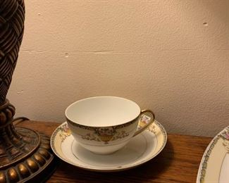 China pattern Plaza by Meito, hand painted, Japan, early 1900s before the War

Description: 
Gold rim plates, platter, saucers, and gold tip on cups
Yellow & Blue Edge, 
Cream & and white trim
Flowers in yellow bowl with filigree to both sides
Bowl has pink flowers & green leaves

•	Bread plates (11) unchipped perfect condition
•	Dinner plate (13) unchipped perfect condition
+ 1 chipped
•	4.5” Saucer (6) unchipped perfect condition, + 2 chipped
•	Luncheon plates (12) unchipped perfect condition
•	Cups (4) unchipped perfect condition + 1 chipped
•	Large Oval platter (1) 16” unchipped perfect condition
