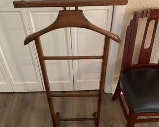 Vintage wood valet butler clothes stand for suit, pants, shirt, belt, tie, shoes

Gleaming vintage suit hanger made in ITALY waiting for you to put your suit, shirt, tie, belt, shoes, and whatever else your little heart desires to get ready for work; hole on the right was for a custom pegged shoe horn, lost in move. 

