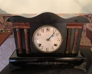 Antique clock: Great condition, like new. Lovely patina. Curved top. Brass lion decoration on sides, brass feet, 2 lovely inlaid double columns both sides.  