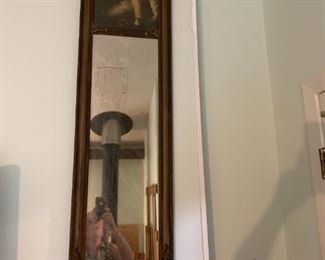 Wonderful tall antique Victorian wall mirror with boy and rabbit in the forest.  Wood frame exquisite detail at the top: adorned with colorful plaster flowers and ribbons. 