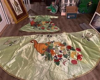 1 of a kind. Bacchus Mardi Gras costume and cape

Awesome and huge for wall display  
Worn in parade in 1990s.

Detailed sequin decoration incudes wine bottle, crawfish, bacchanalian cornicopia, Creole tomatoes, pears, mirlitons, apples, bananas, Satsuma orange, carrots, grapes, celery, etc.

Oh my golly.  Didn’t take photo of back of costume.  Probably more stuff depicted, like maybe the “holy trinity of N’Awlins food”!  Tomorrow maybe.  3am now. Too darned late. 
