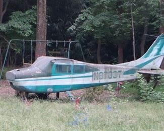 Real fuselage from single engine plane, turned into playground structure