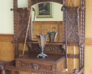 Coat/hat/cane/umbrella stand.