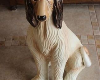 Tall statue of an Afghan hound.