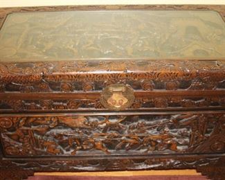 Asian themed carved trunk.