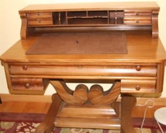 Writing desk with secretary drawers.