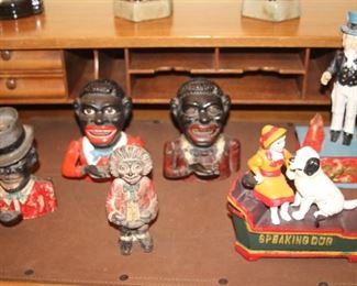 Two reproduction coin banks and four original antique banks.