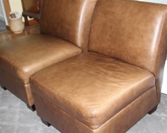 Two armless leather chairs.