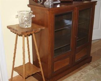 Arts and crafts style table, two door bookcase.