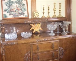 Brass candle sticks and crystal bowls.