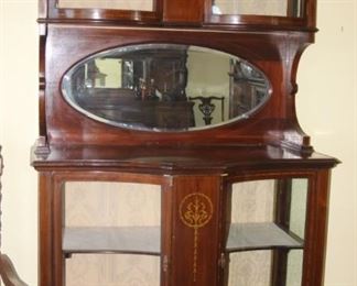 Elegant bar/curio with concave and convex glass doors and mirror.