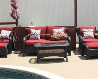 Seven piece hampton Bay resin patio set with cushions and covers.