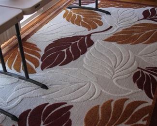 Two indoor outdoor area rugs.