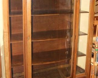 Bow front curio cabinet.