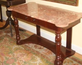Marble top entry table with drawers.