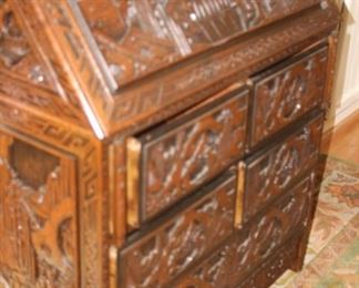 Heavily carved Asian drop down desk.