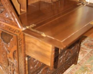 Heavily carved Asian drop down desk.