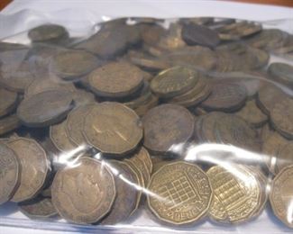 Bag of 3 pence coins.
