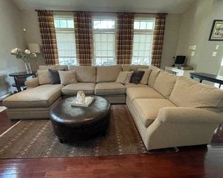 $5,000 Arhaus Landsbury three piece large chaise sectional in oatmeal fabric - This transitional style features plush, padded cushions, rolled arms, and an abundance of toss pillows. Dimensions: 159" W X 103" D X 38" H