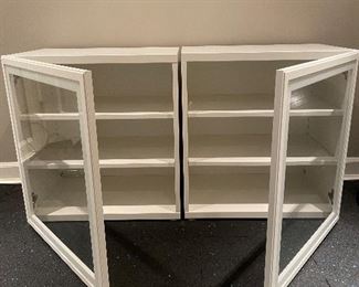 $200 - pair of white storage cabinets with shelf and glass doors - sold as a set - 24”l x 16.5”w x 25.5”h