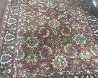 $250 - Area Rug - Casual, non-shedding wool pile area rug in rust - 5’ x 8’