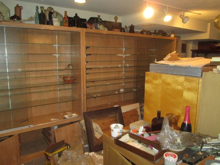 Basement Left Stairs: Great Display Cases with Glass Shelves and Glass Doors. There are 3 of them.