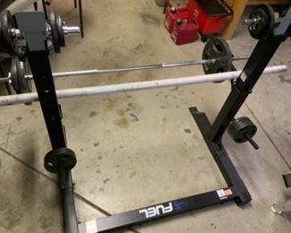squat rack with weights and weight bars