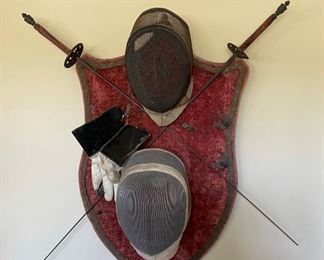 Antique fencing swords, masks and gloves