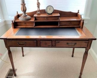 Vintage writing desk with leather inlay top.