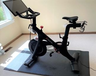 Peloton bike with floor mat and 2 2lb. weights, Gen. 1