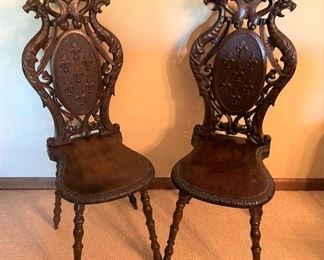 Unique antique chairs with spindled legs,  carved fleur de lis and dragon figures , believed to be taken from a European castle.