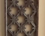 Decorative carved wooden panel.