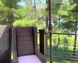 Arhaus outdoor wicker chair with Frontgate umbrella