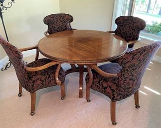 Game table with beautifully upholstered rolling chairs (table is 4' diameter).