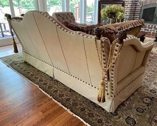 Century sofa (back detail) Leather and upholstery with grommet details, large pillows and leather bolster pillows