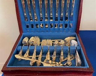 Gold toned International flatware