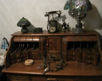 Oak Desk. Lamps. Old style telephone.