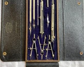 set of vintage compasses, calipers, engineering and navigational tools