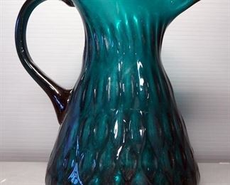 Colored Glass Pitcher With Artistic Pattern In Glass