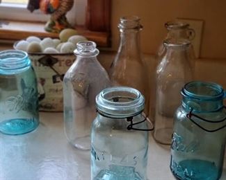 Various milk bottles and blue canning jars 