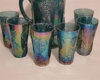 Carnival glass pitcher and glasses 