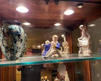 . . . this sale is full of treasures.  The owner's curio is very large and filled with Lladros, and beautiful vases like this one!