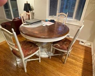 . . . a beautiful dining room table and chairs -- table has four leaves